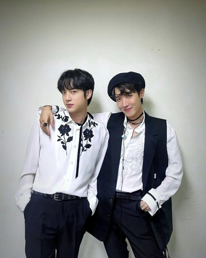 This contains an image of BTS JIN and JHOPE.