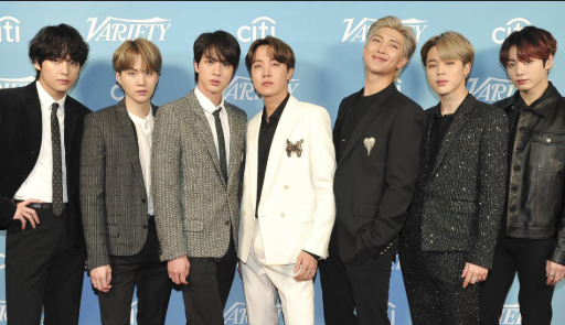 This contains an image of BTS Members